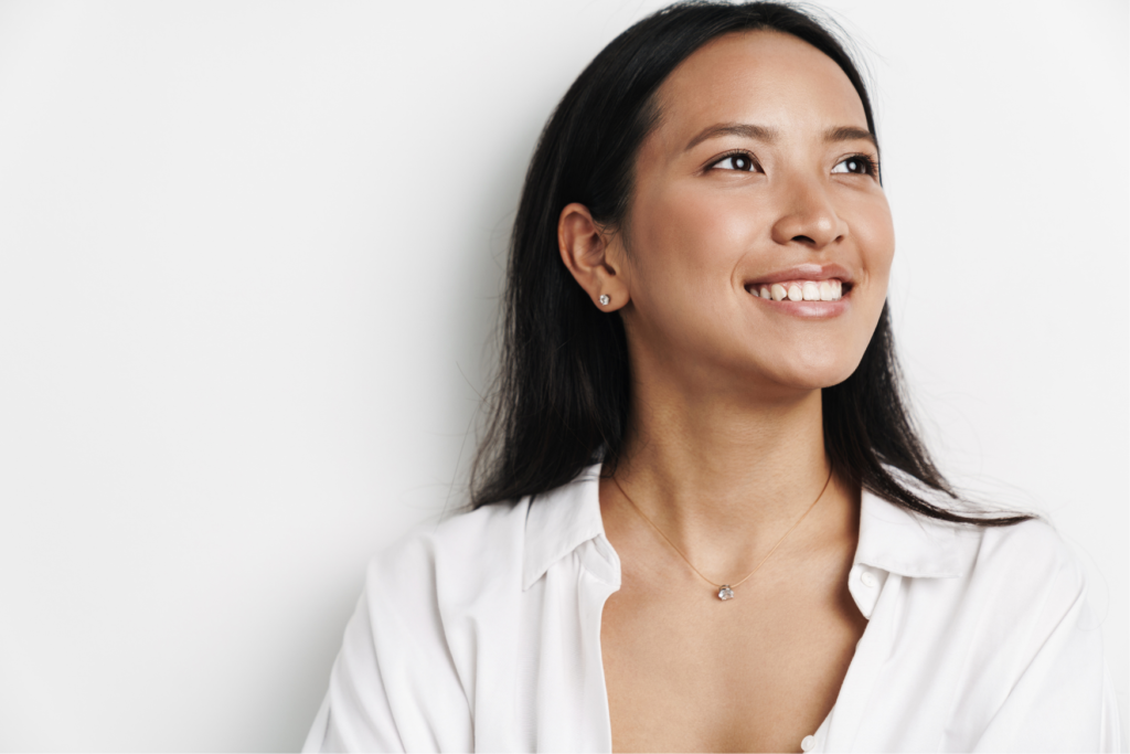 A woman smiling broadly